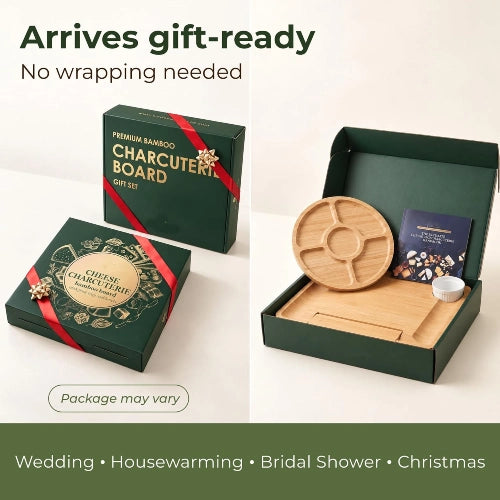 Gift-ready dark green presentation box containing square bamboo charcuterie board, round fruit platter, and ceramic bowl with red ribbon accents.