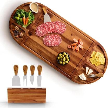 30-inch modular acacia wood charcuterie board fully assembled with appetizers, charcuterie meats, crackers, olives, and a 4-piece cheese knife block set on white background.