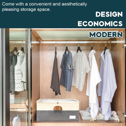 Large shoe organizer storage box in beige and grey positioned on the lower shelf of a modern wooden wardrobe closet with hanging shirts