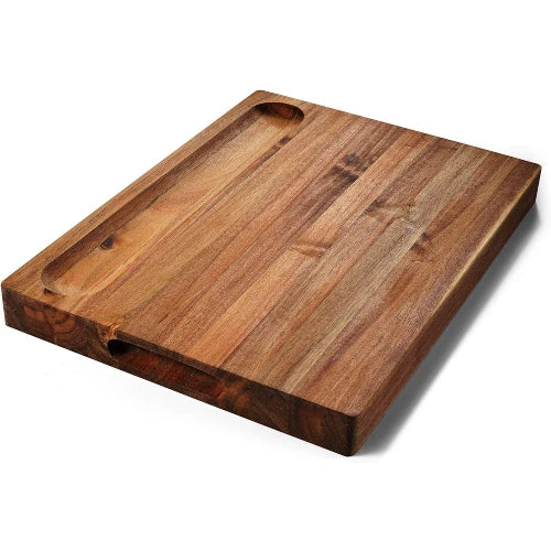 Solid acacia wood butcher block showing the reverse flat serving side with carved cracker and bread holder slot
